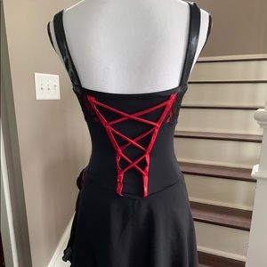 Black and red corset back ice skating, ice dance